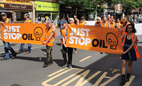 Just Stop Oil protesters march on a road