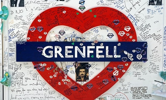 Wall memorial with Grenfell heart in the style of a London Underground sign