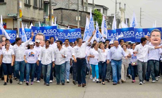 Guillermo Lasso marches in the street with supporters