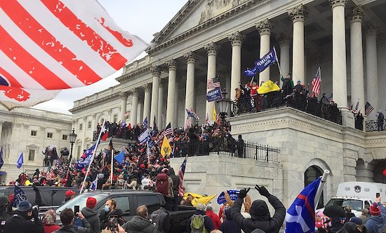 Protesters storm the steps outside the US Capitol building