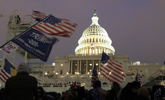 US Capitol with 'Trump 2020' flag in foreground