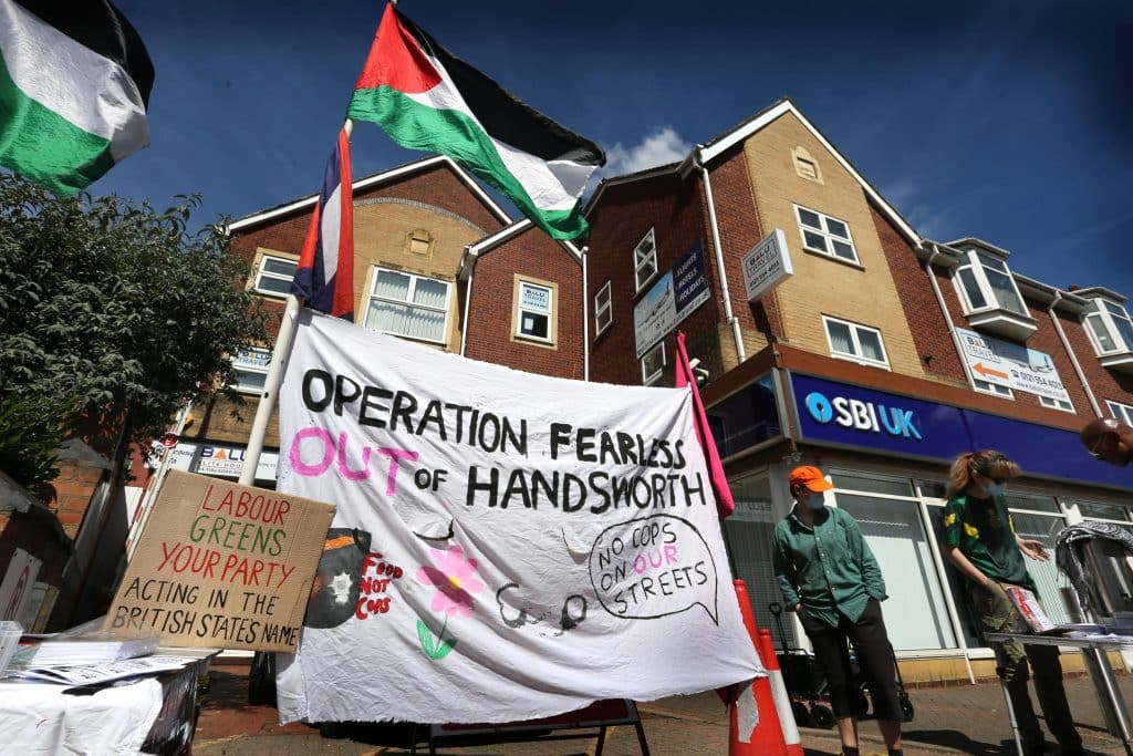 Protesters outside the offices of the Soho Road Business Improvement District opposing Operation Fearless